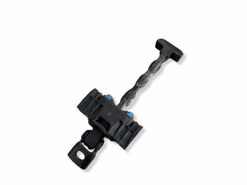 Front door check strap stopper