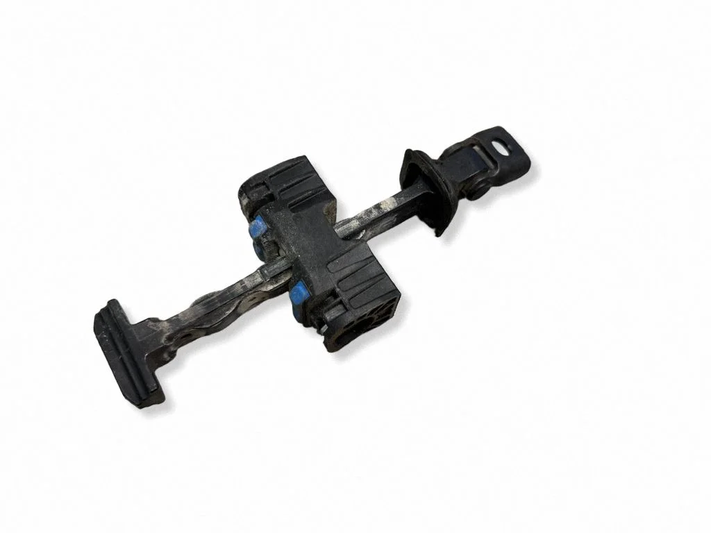 Front door check strap stopper