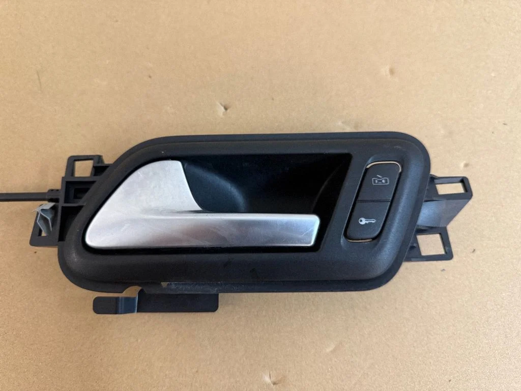 Front door interior handle – left