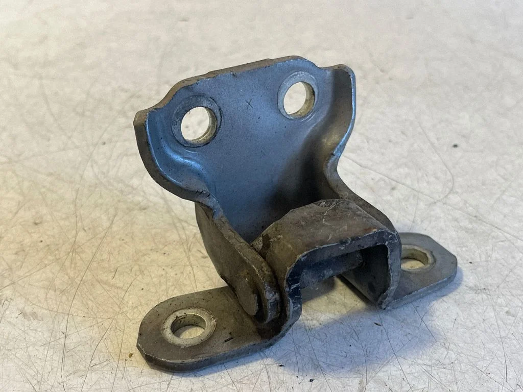 Front door lower hinge – left
