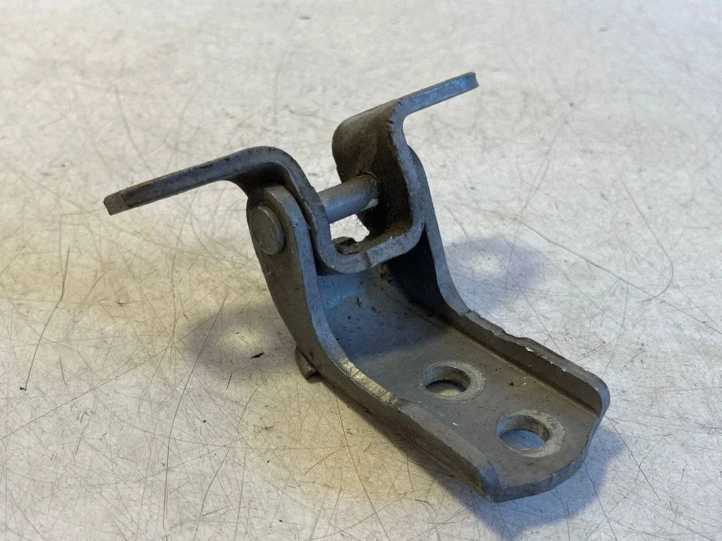 Front door upper hinge – left