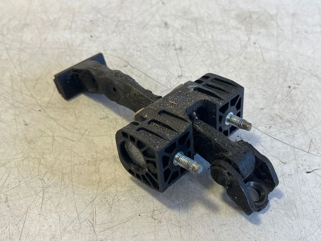 Rear door check strap stopper – Opel Astra H (2004-2012), left