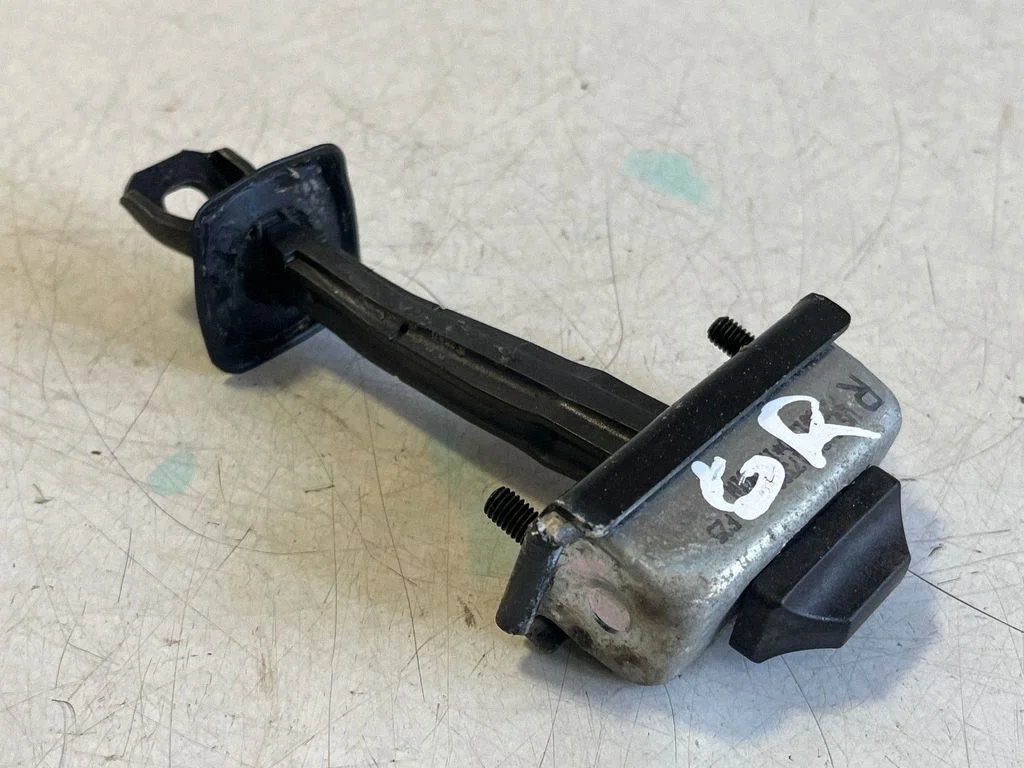 Rear door check strap stopper – right