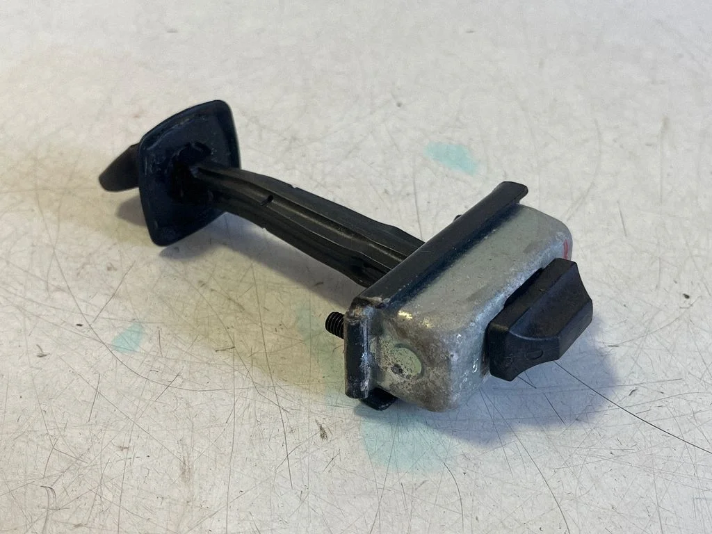 Rear door check strap stopper 7205613