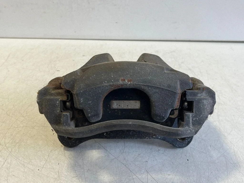 Front brake caliper – left