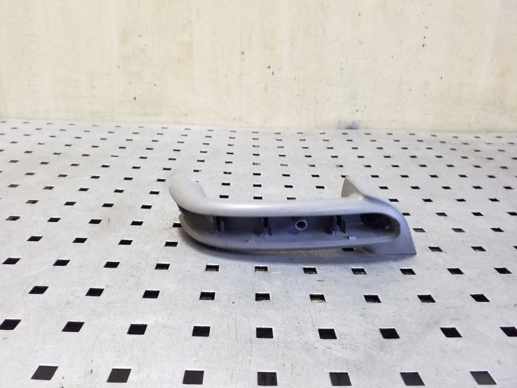 Rear door handle trim – left