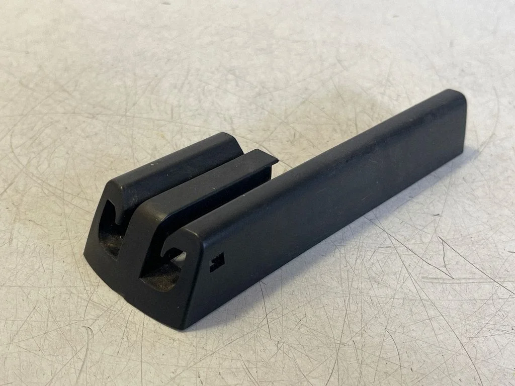 Front driver seat rail trim 103167500A – Tesla Model X (2015-)
