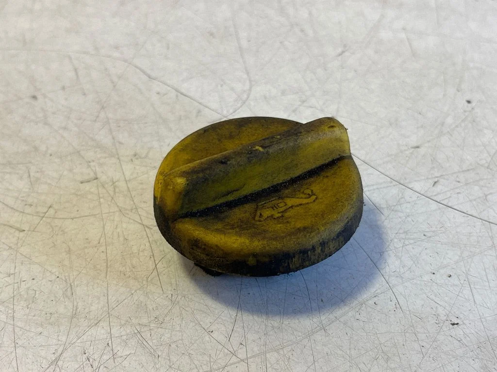 Tepalo užpylimo angos dangtelis