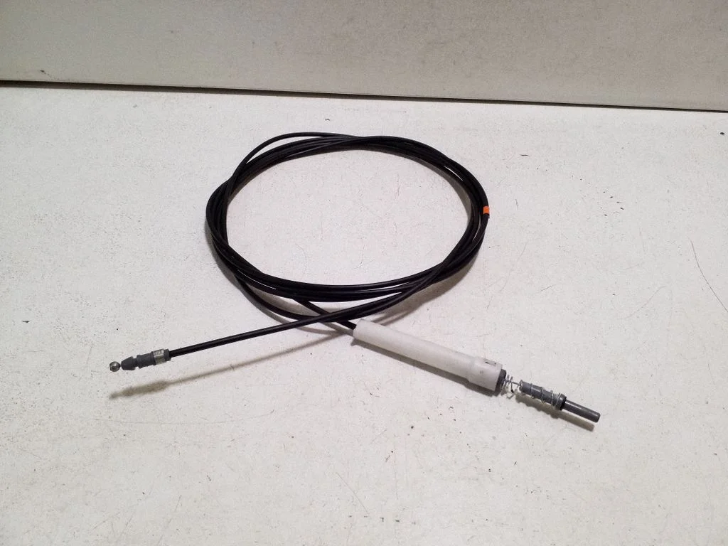 Fuel cap flap release cable