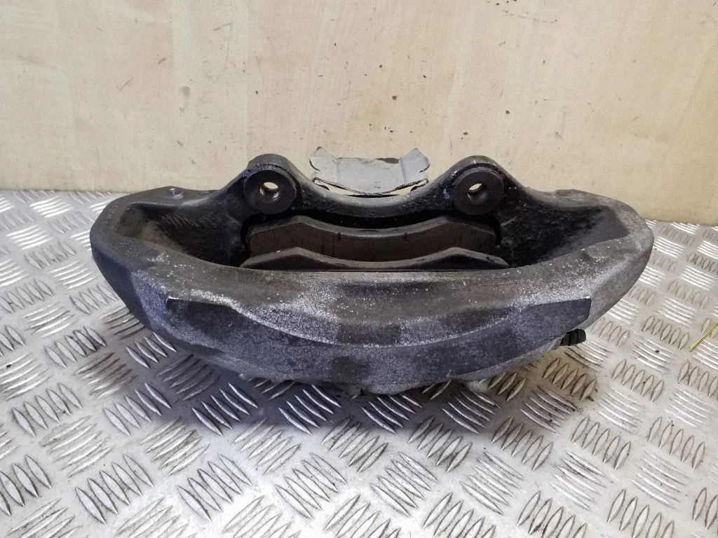 Front brake caliper 20A6470500