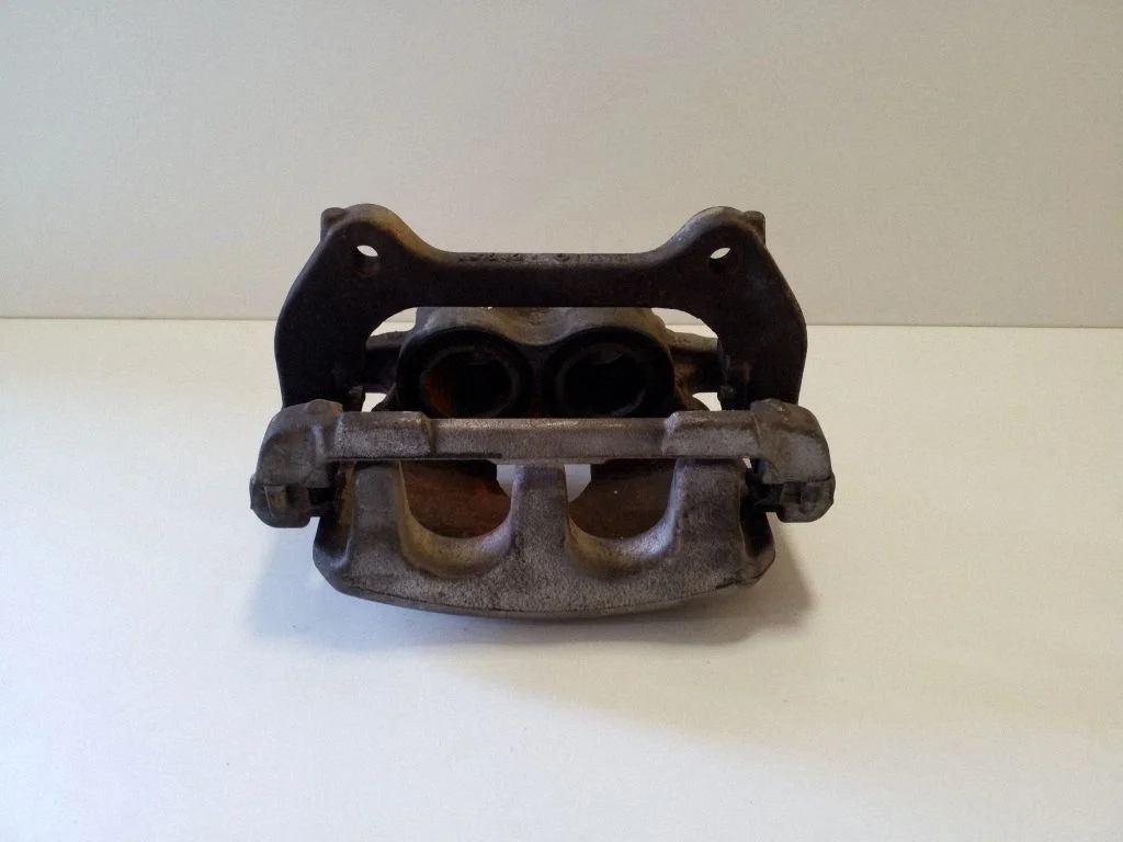 Front brake caliper M8D22B118AA