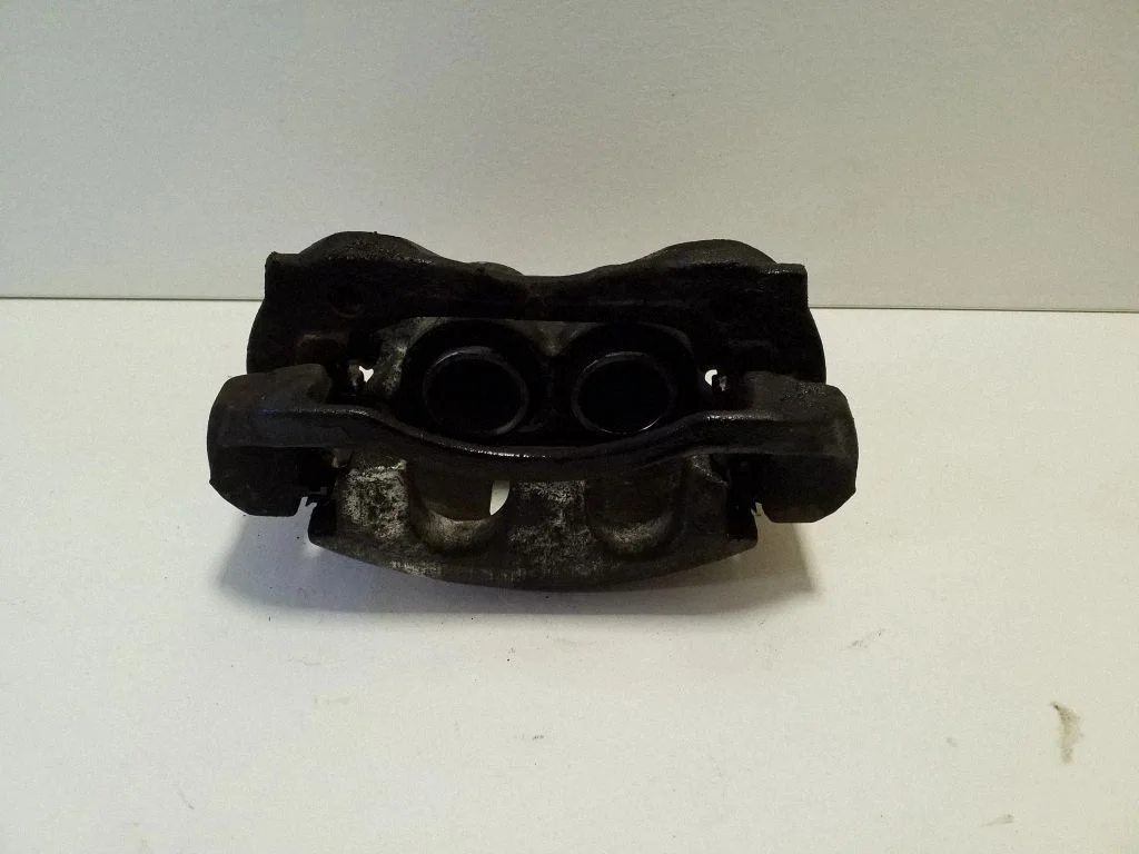 Front brake caliper – left