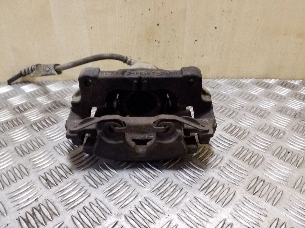 Front brake caliper DG9C2B134C