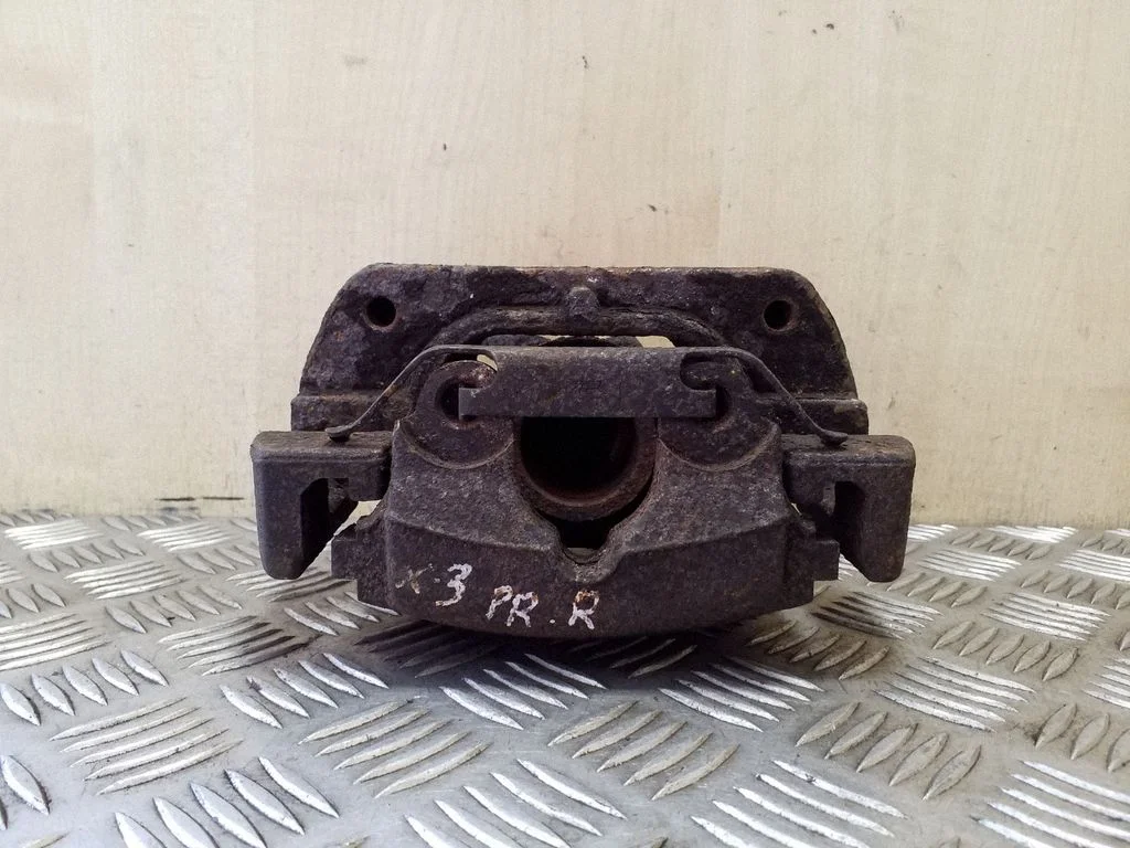 Front brake caliper – right