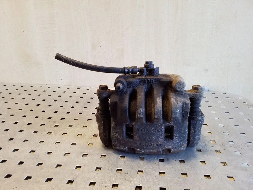Front brake caliper – left