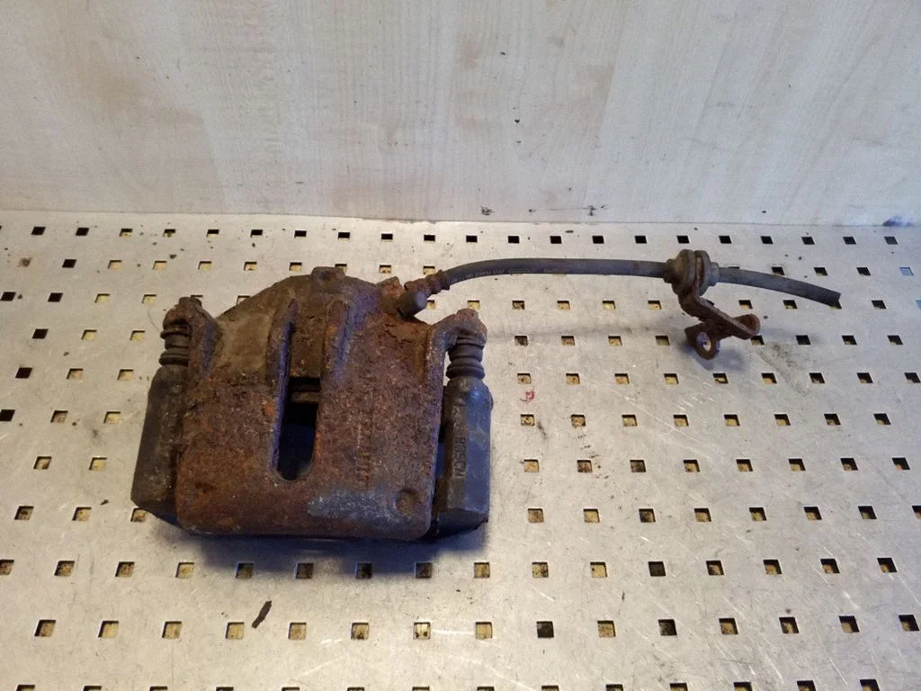 Front brake caliper – Renault Megane II (2006-2008), left