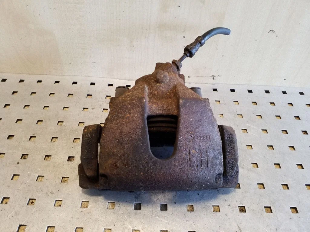 Front brake caliper – Ford Focus (2010-2017), left