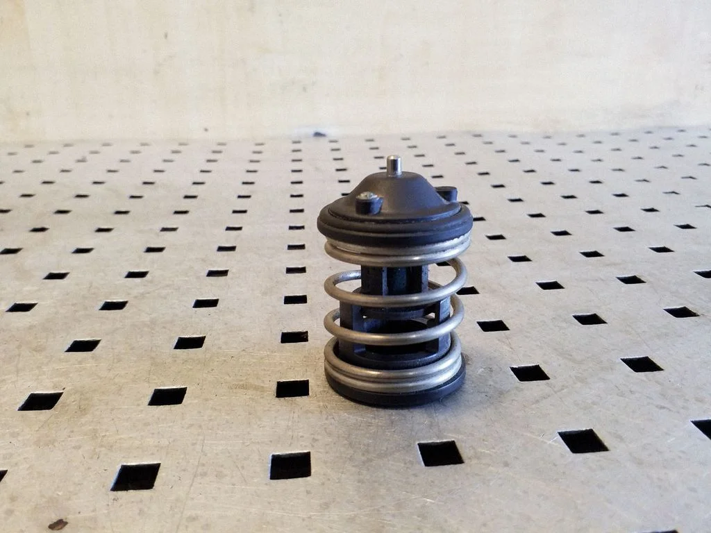 Thermostat/thermostat housing