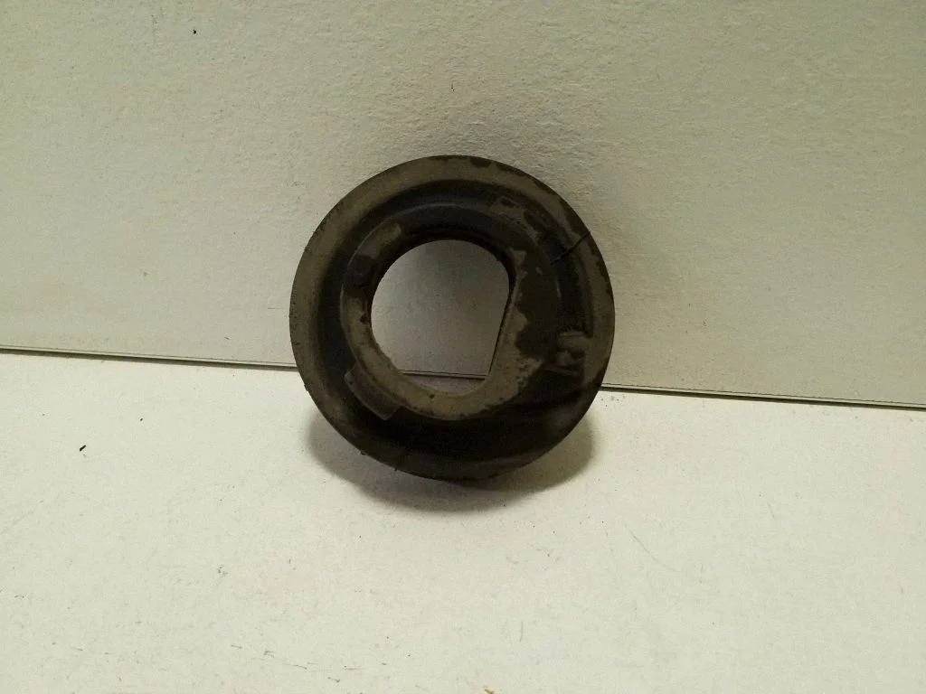 Rear coil spring rubber mount GX733C357AA