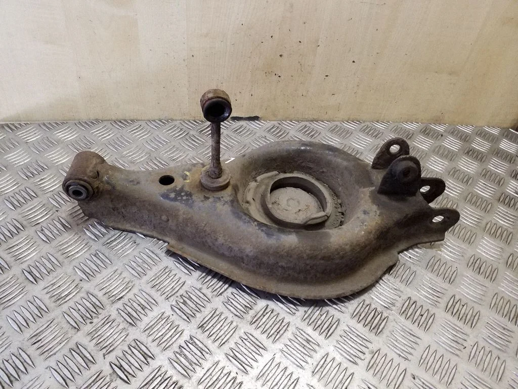 Rear upper control arm/wishbone – left