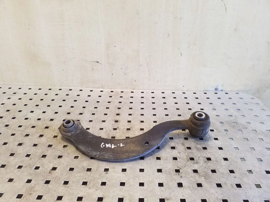 Rear upper control arm/wishbone – left