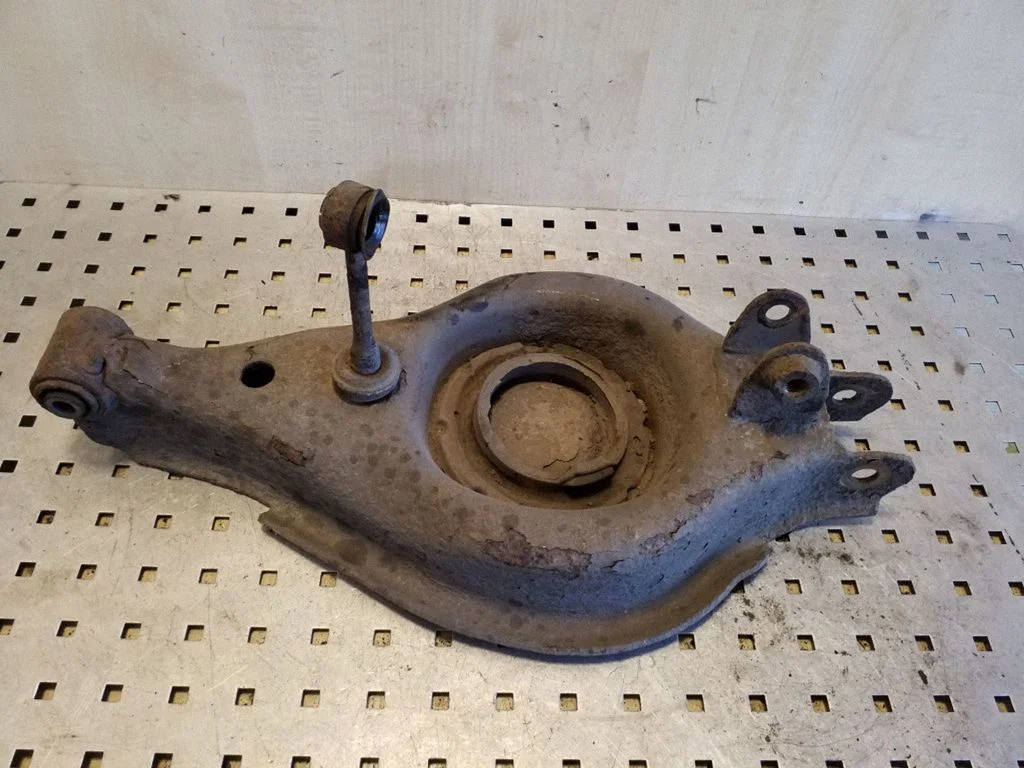 Rear upper control arm/wishbone – left