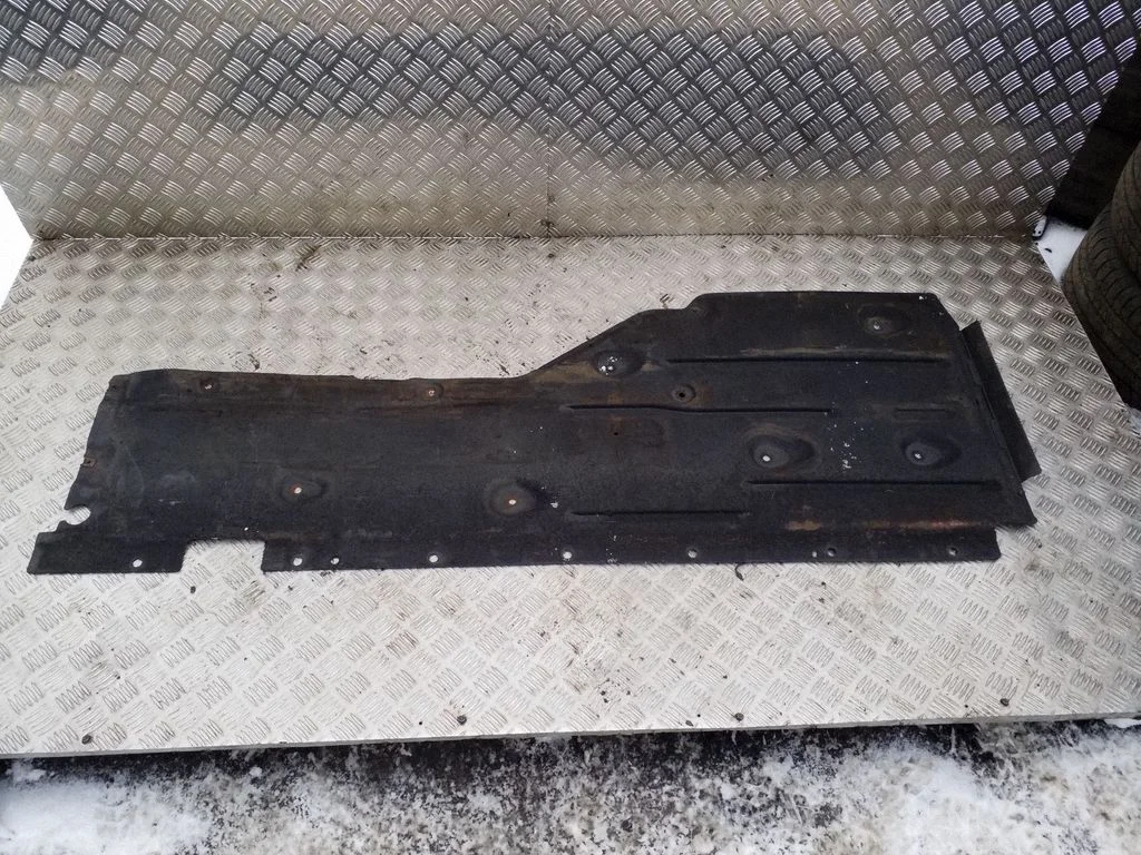 Center/middle under tray cover – right