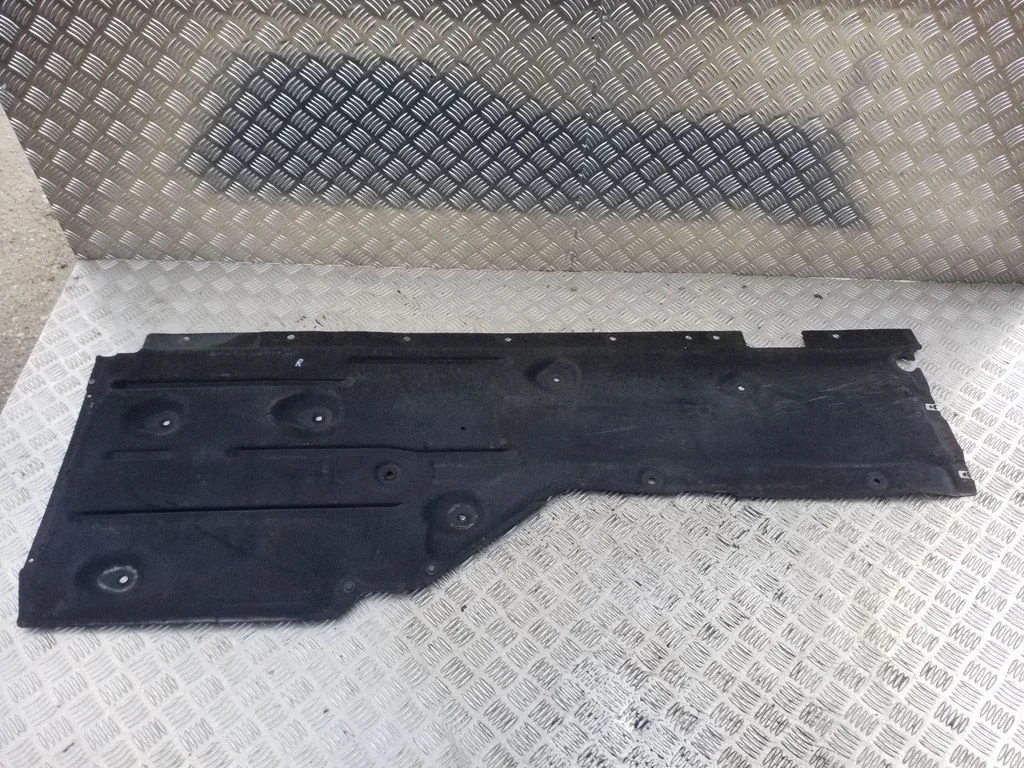 Center/middle under tray cover – right