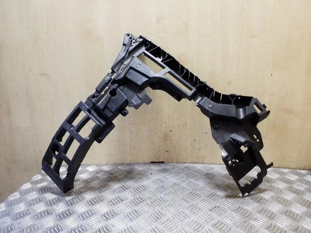 Rear bumper mounting bracket – left
