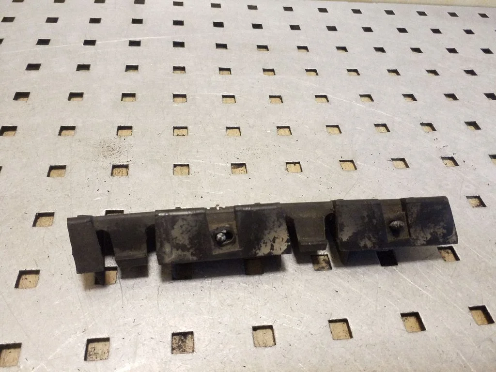 Rear bumper mounting bracket – right