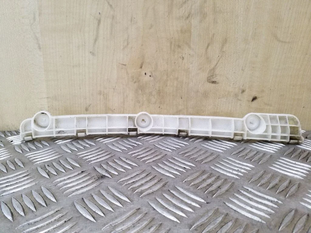 Rear bumper mounting bracket – left