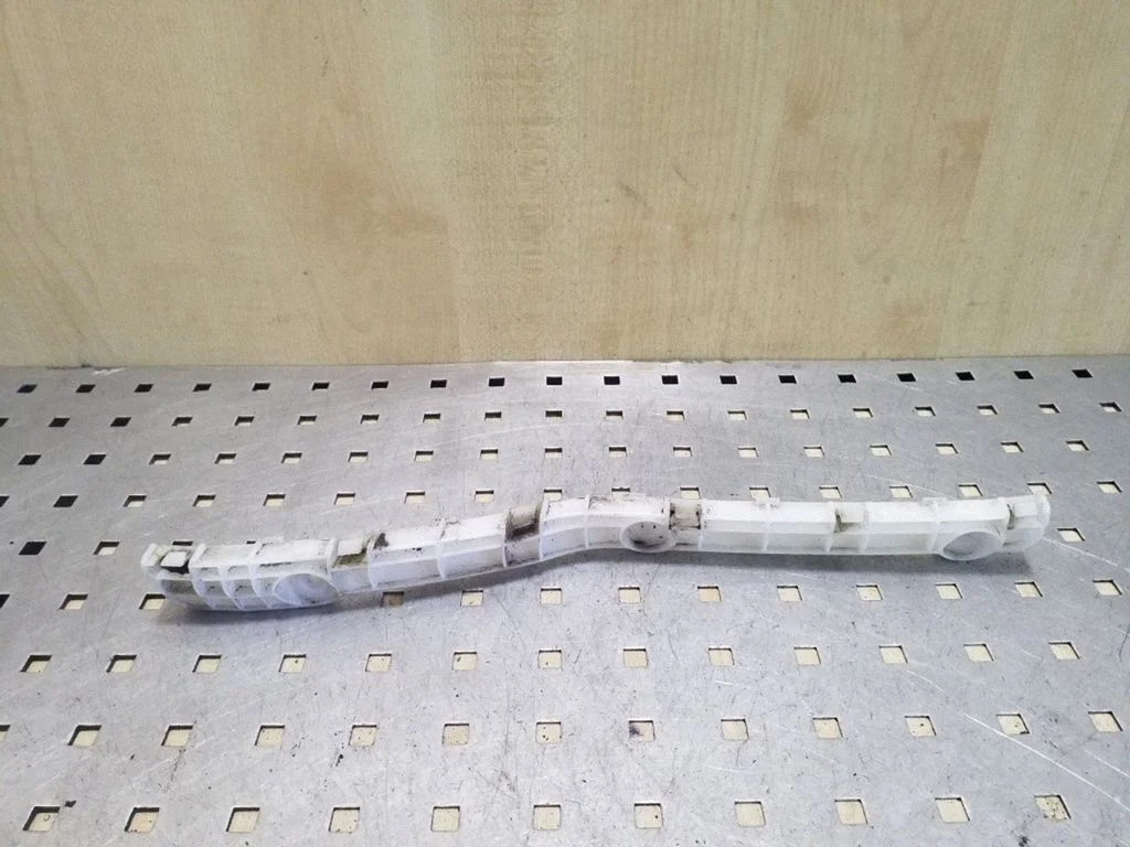 Rear bumper mounting bracket – left