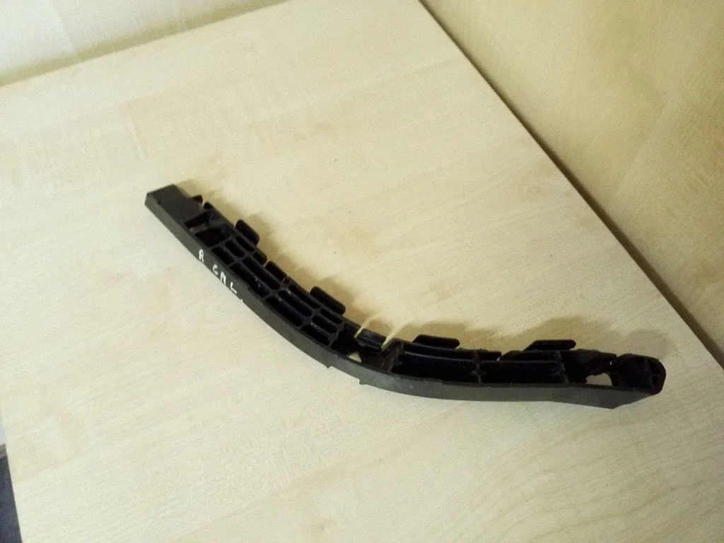Rear bumper mounting bracket – right