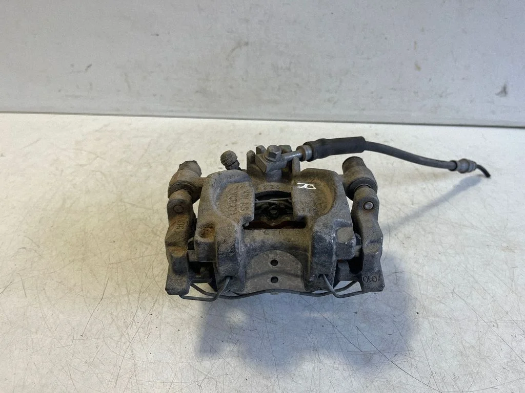 Rear brake caliper – right