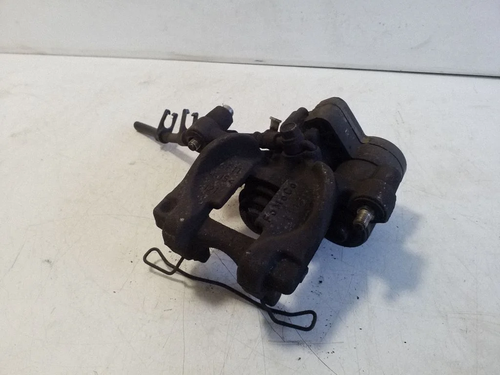 Rear brake caliper – left