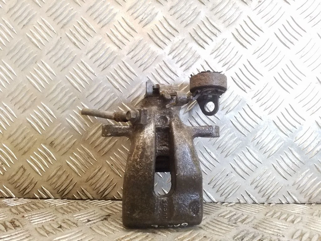 Rear brake caliper – left