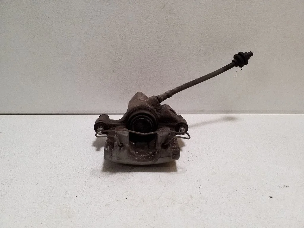 Rear brake caliper – left