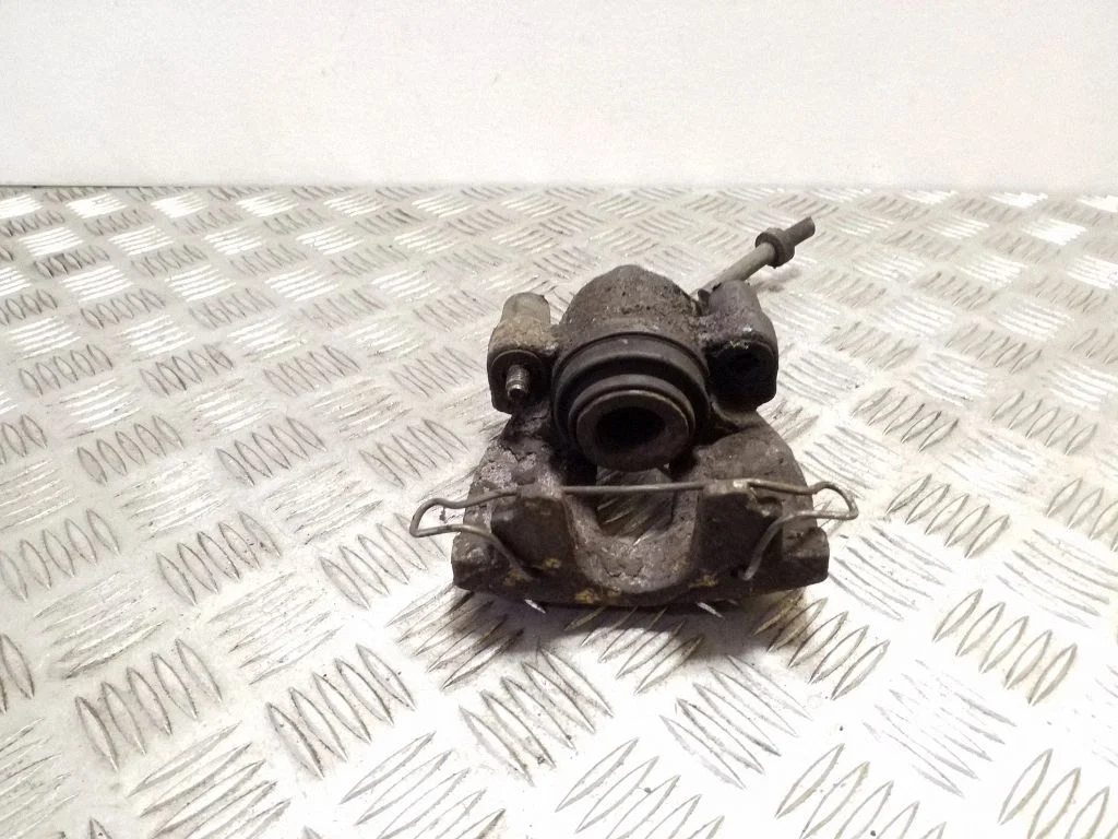 Rear brake caliper – left