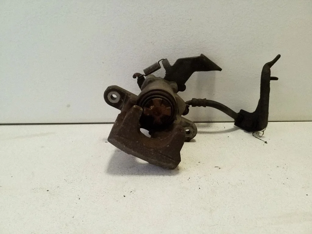 Rear brake caliper – left