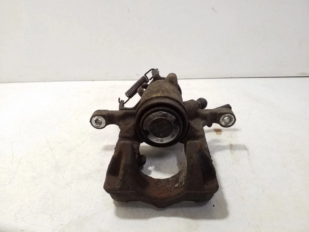 Rear brake caliper – left