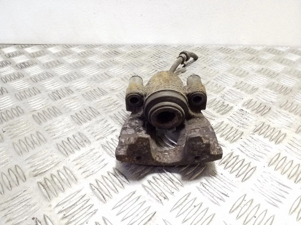 Rear brake caliper – left