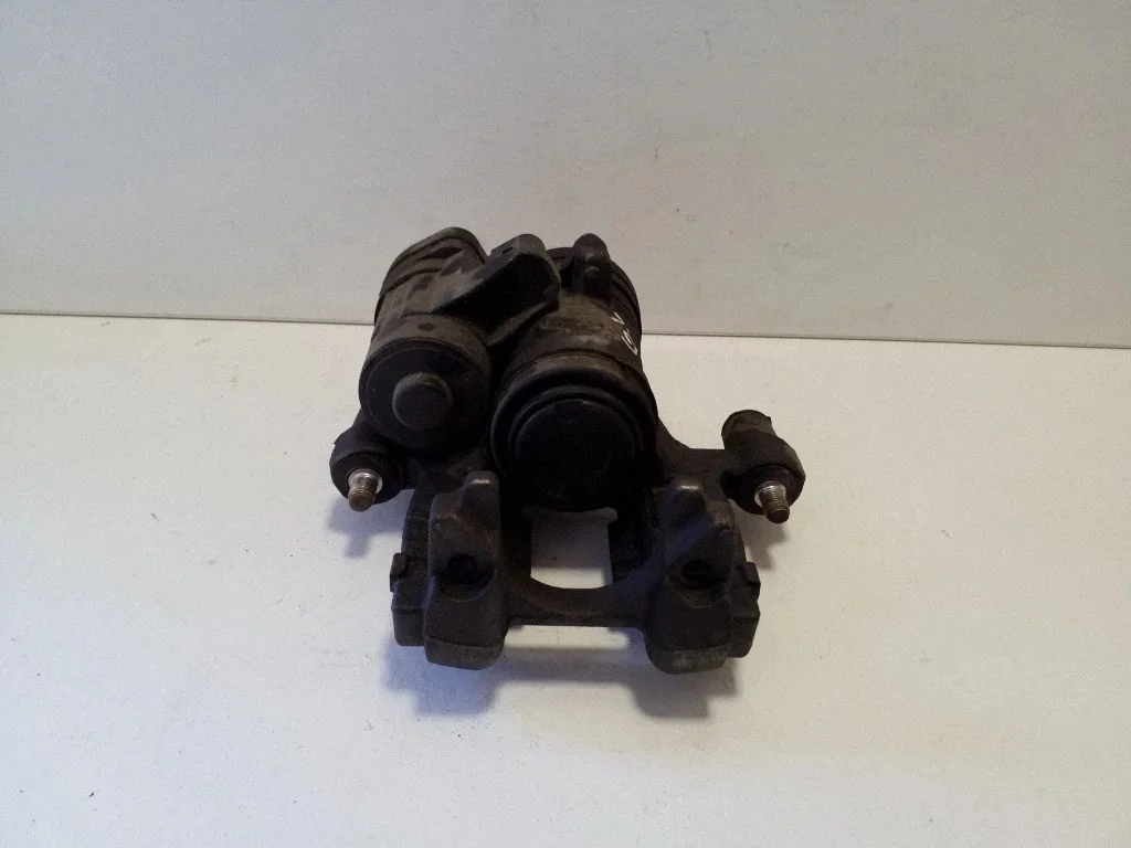 Rear brake caliper – left