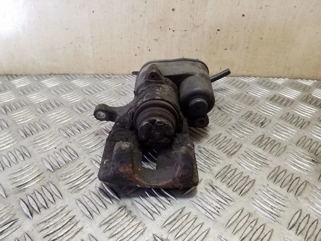 Rear brake caliper – left
