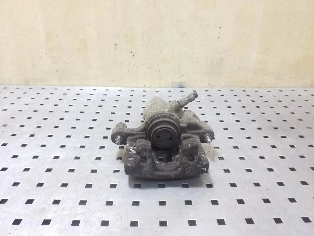 Rear brake caliper – left