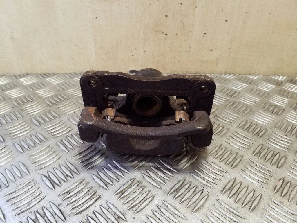 Rear brake caliper – left