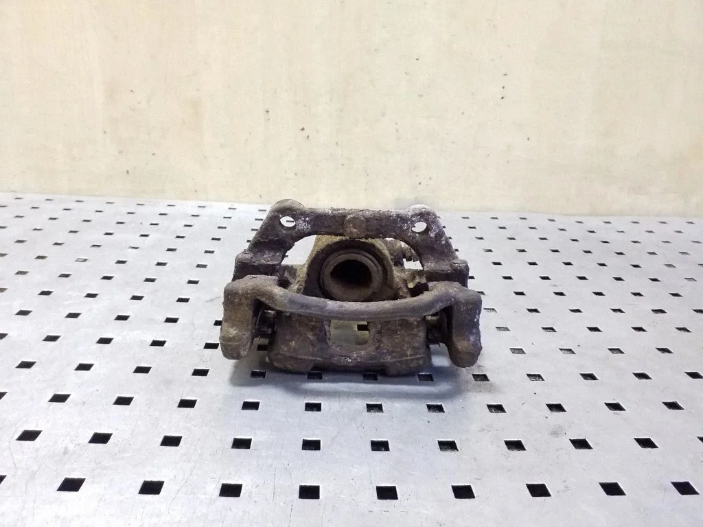 Rear brake caliper – left