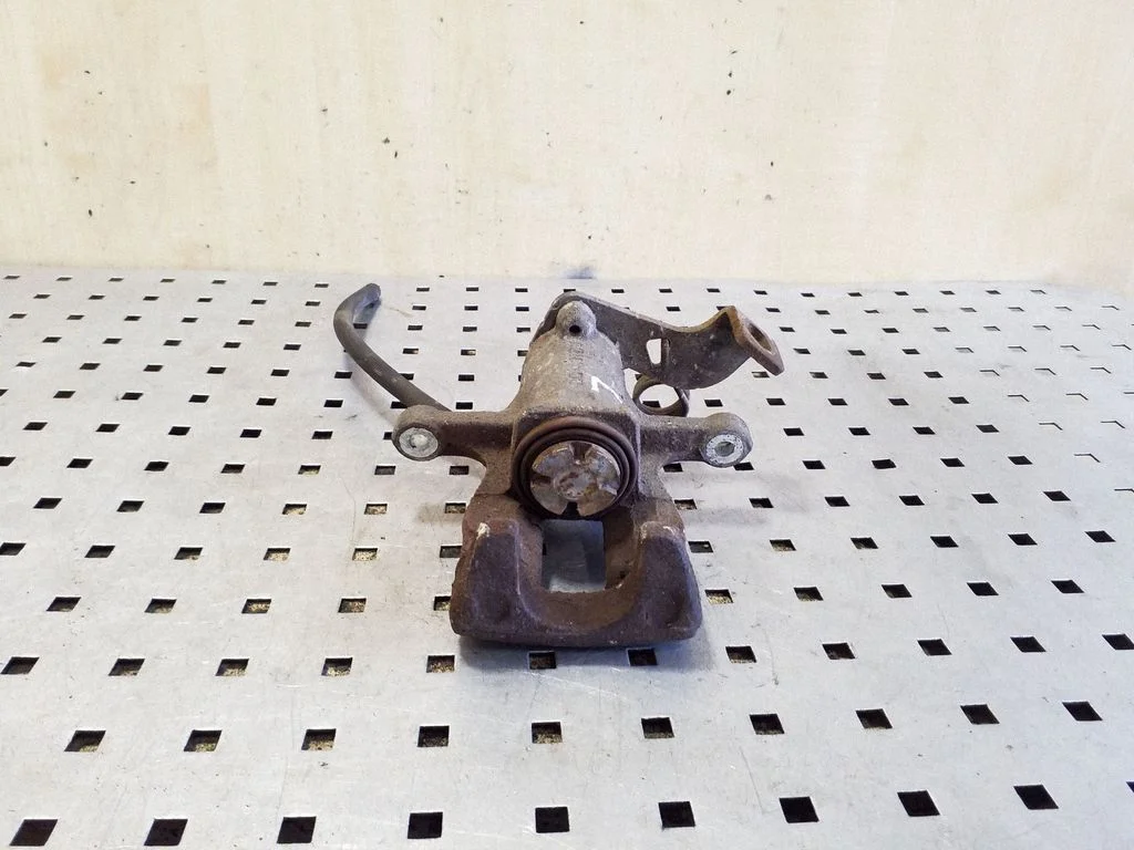 Rear brake caliper – left