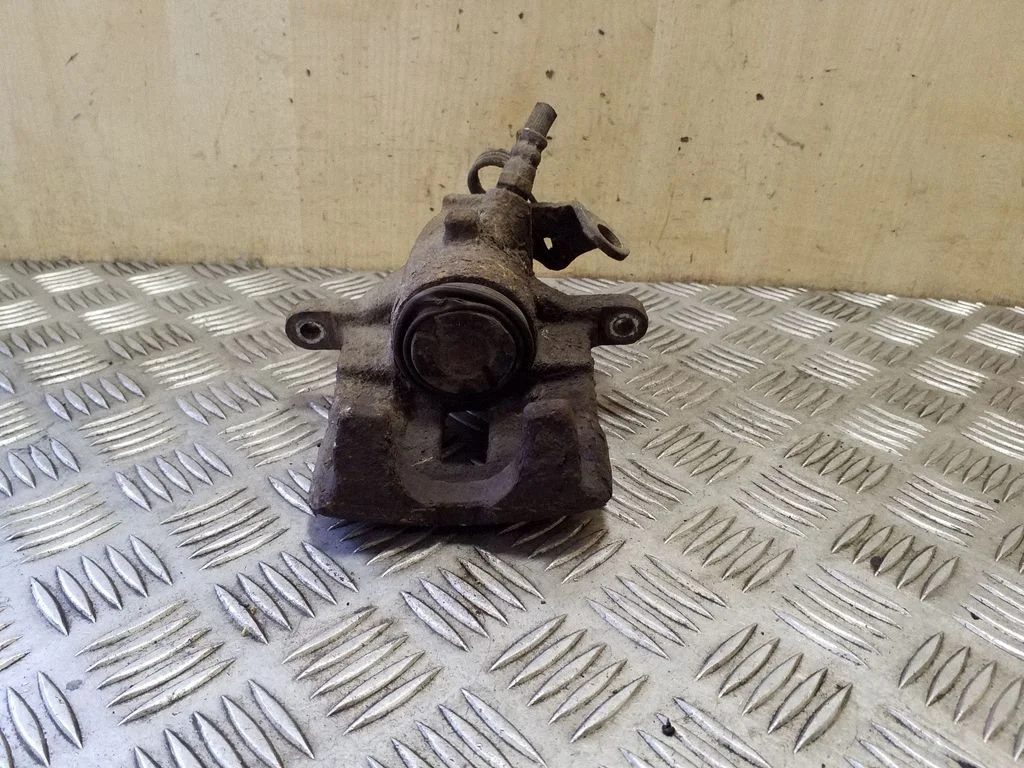 Rear brake caliper – right