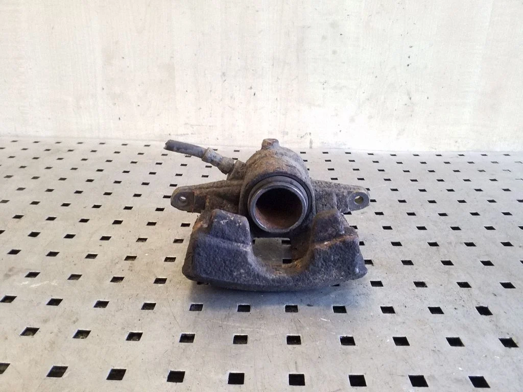 Rear brake caliper – left