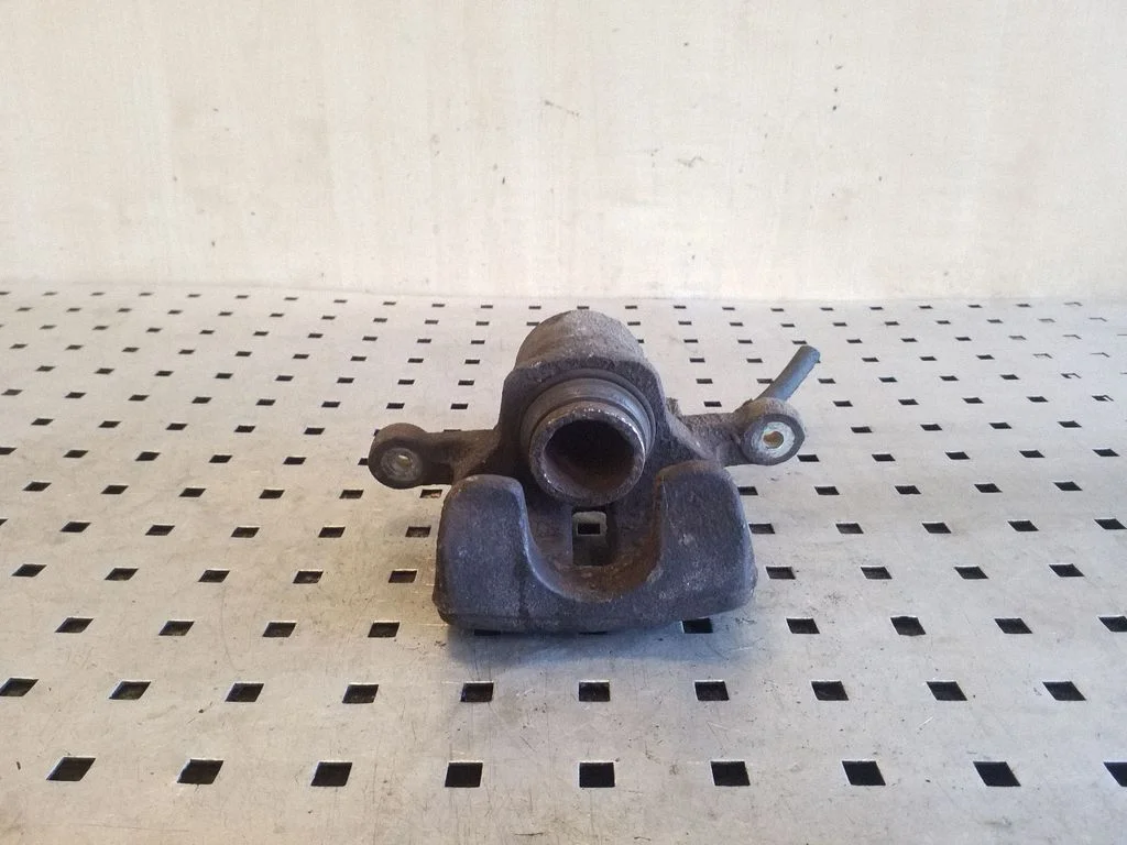 Rear brake caliper – left